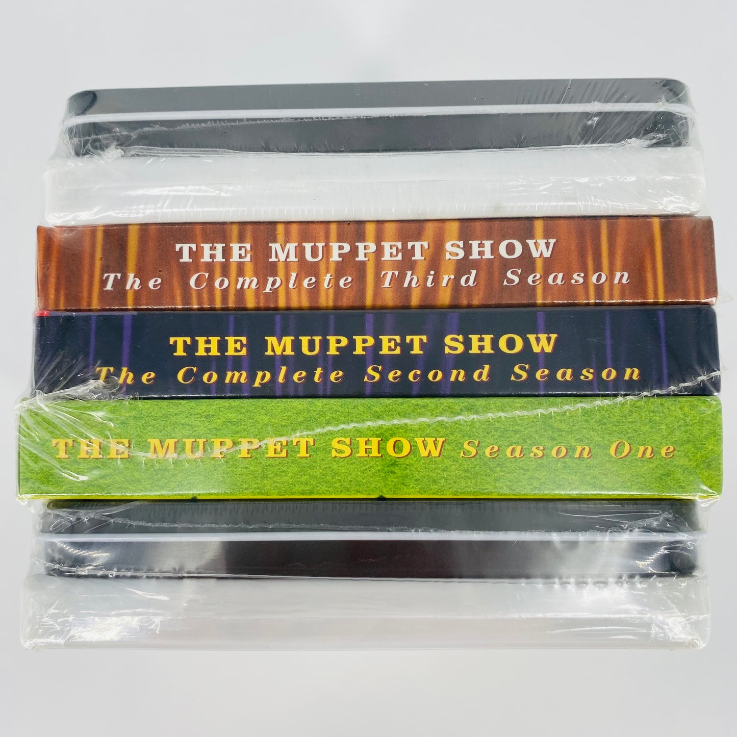 The Muppet Movie, Muppet Treasure Island & The Muppet Show Seasons 1-3 DVD's, 2 activity sets, 2 tin cases, 1 sticker sheet, 1 notepad, 2 pencils, and 1 pencil sharpener