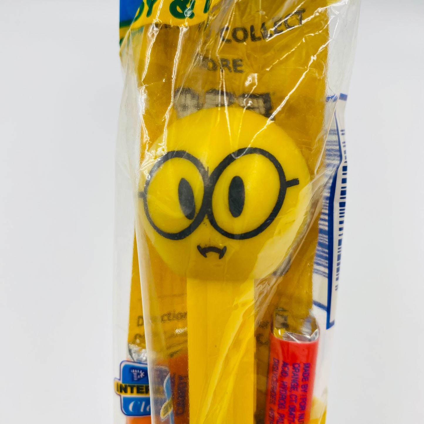 Funky Faces Nerdy Face yellow stem PEZ dispenser (2003) bagged 4.9 Hungary blue cello