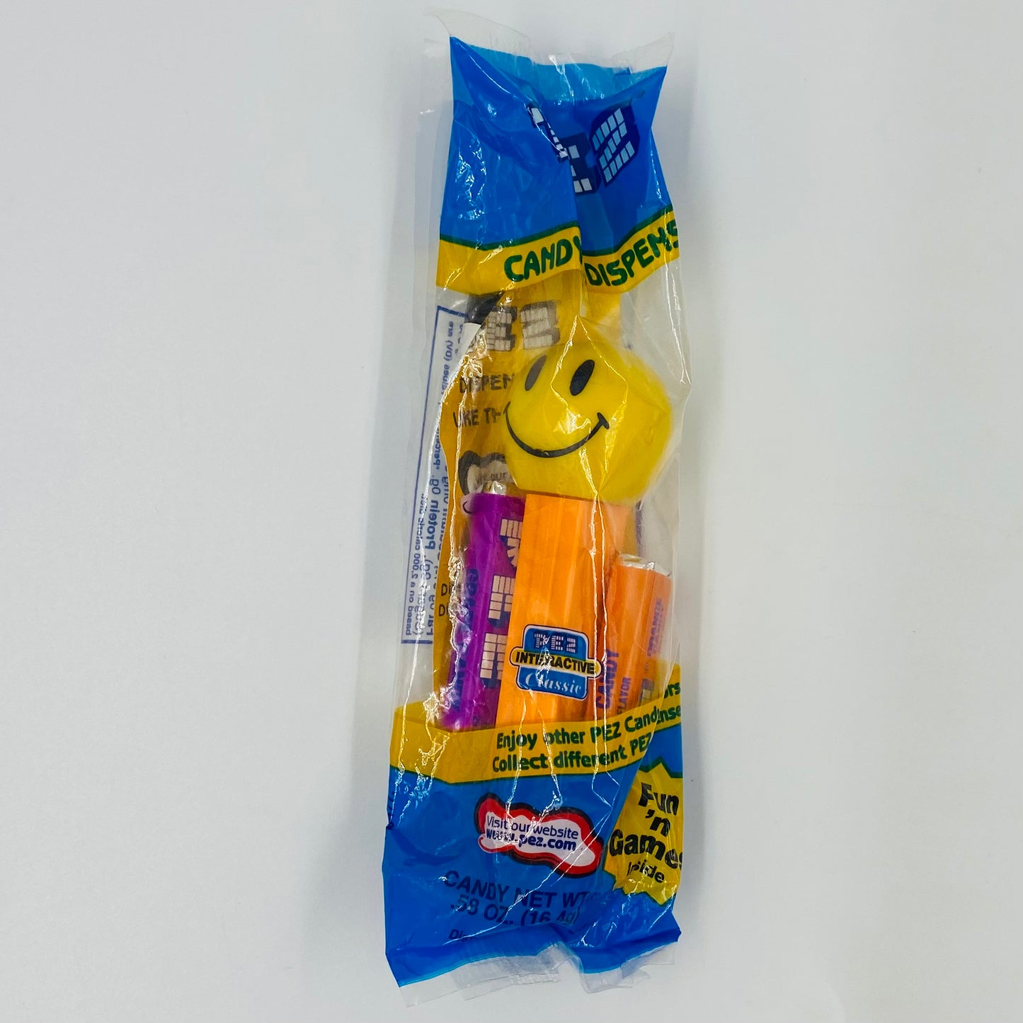 Funky Faces Smiley Face orange stem PEZ dispenser (2003) bagged 4.9 Hungary blue cello