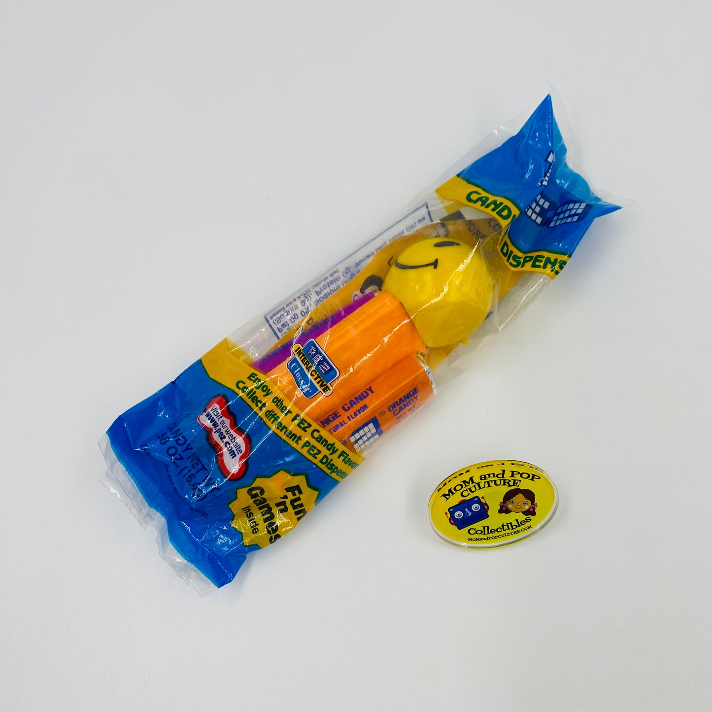 Funky Faces Smiley Face orange stem PEZ dispenser (2003) bagged 4.9 Hungary blue cello