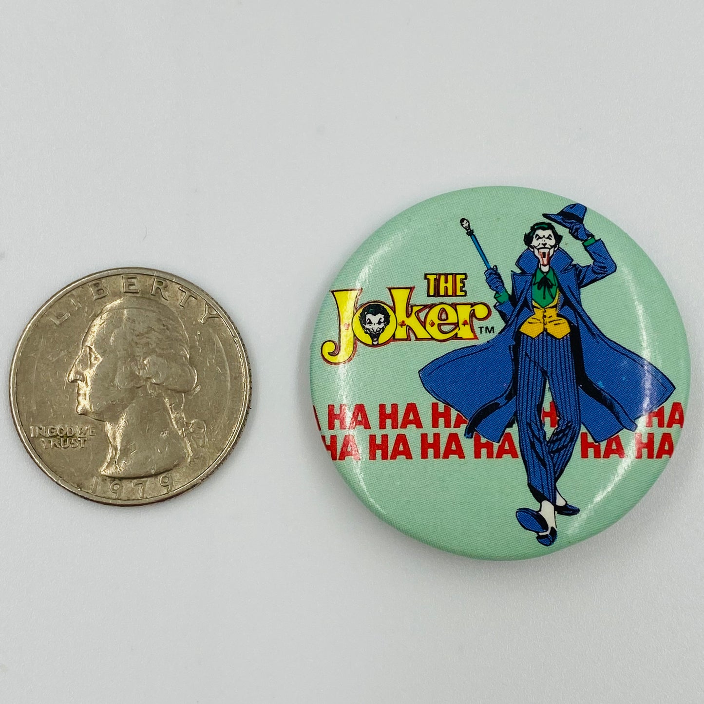 Joker: Logo Strut pinback button (1982)